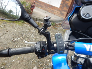 The control to the right of the camera mount is a remote control for my helmet mounted bluetooth headset.